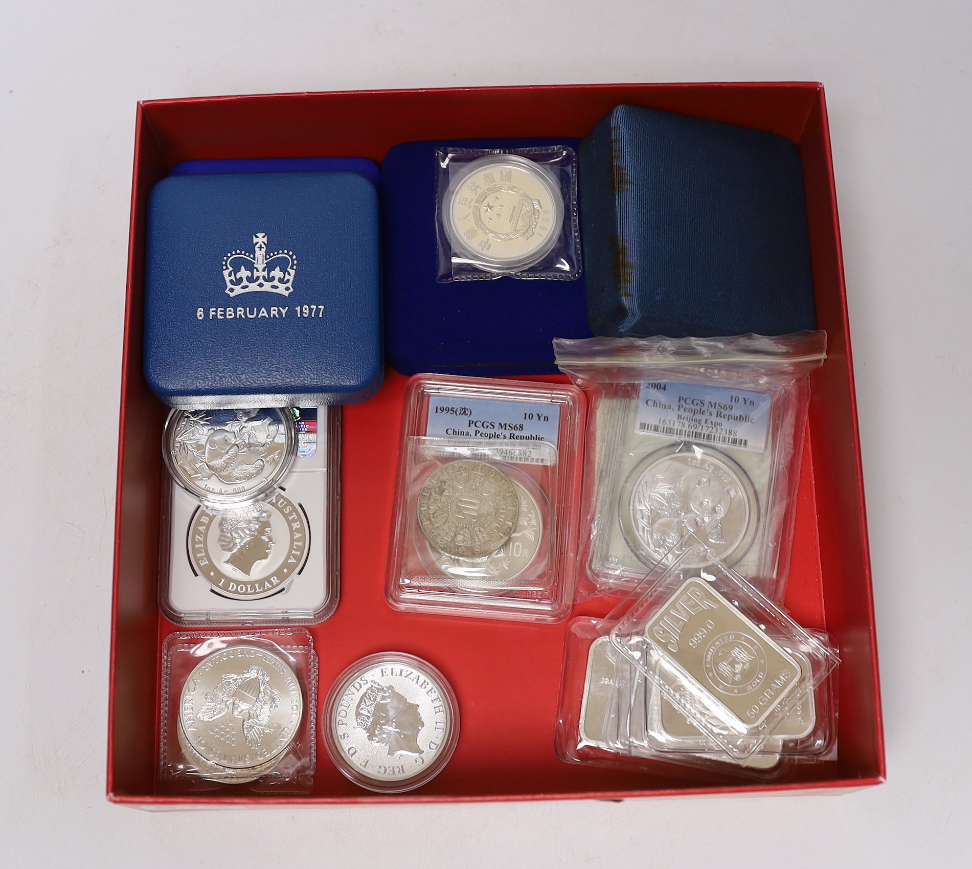 Nineteen silver commemorative coins, medals or silver ingots, including Australia $1 koala 2012p, NGC graded MS 69, People’s Republic China 10 yuan 1995, PCGS graded MS 68 and 10 yuan 2004, PCGS graded MS 69